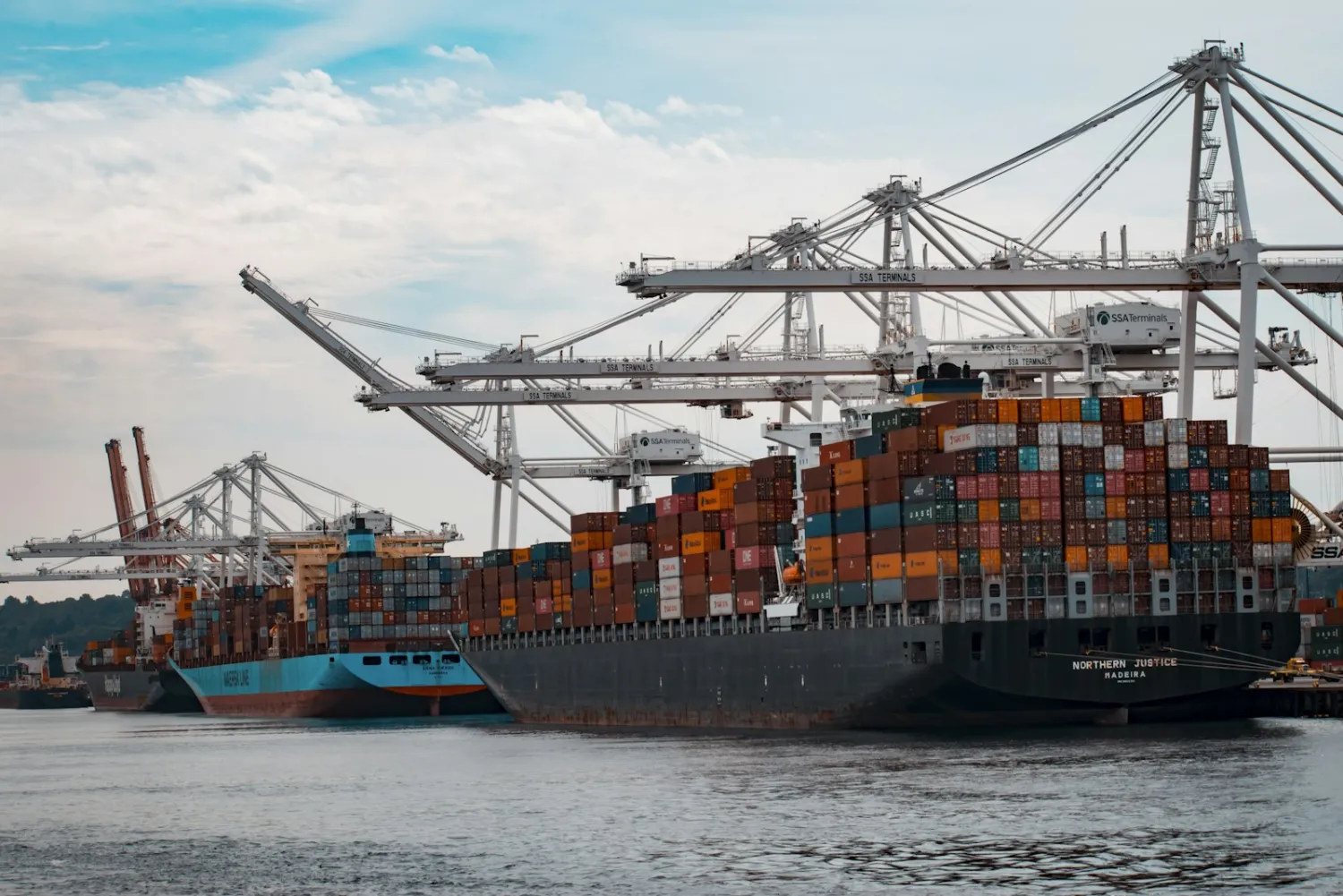 Container ship loaded with cargo at a port.